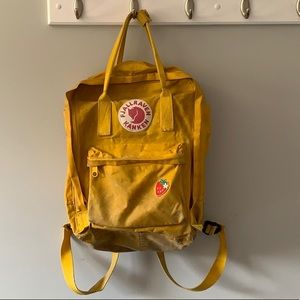 Yellow Fjallraven Kanken backpack